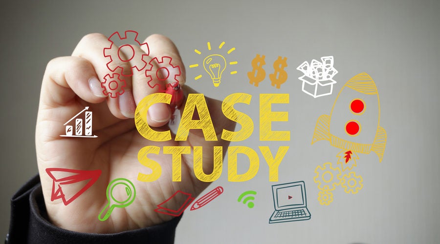 Hand writing CASE STUDY and business icons on transparent white board