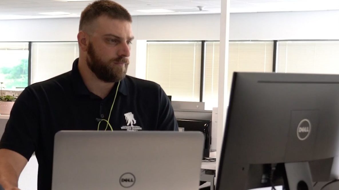 Dell Boomi military veteran intern, working at standup desk