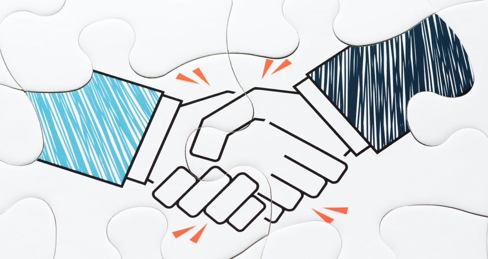 Drawing of two hands shaking hands, overlaid on on connected puzzle pieces.