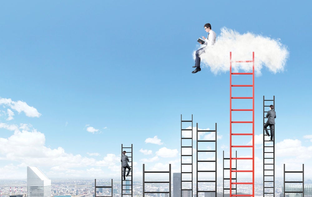 A businessman with a book sitting on a cloud over Paris, two businessman climbing several ladders to the blue sky under the cloud. Side view. Concept of dream and aspirations.