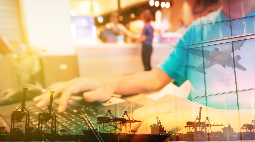 Double Exposure of Man with Laptop computer in Food Plaza or Coffee shop and Transportation Scene, airplane, Port with Power Crane.